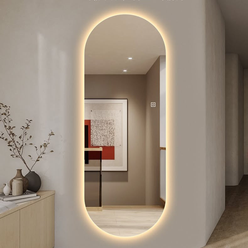 Elevated oval mirror with LED lighting in a modern interior setting.